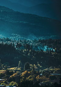 High angle view of sea and mountains against sky