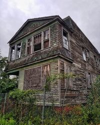 Low angle view of old building against sky