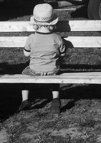 Rear view of girl standing on steps