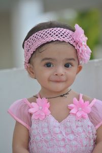 Portrait of cute girl with pink flower