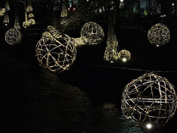 Illuminated ferris wheel at night