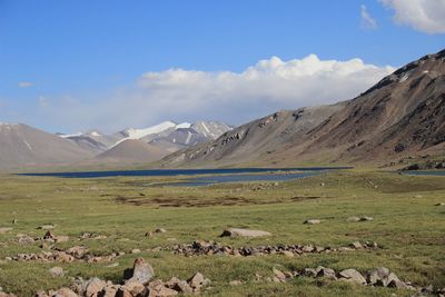 Scenic view of landscape and mountains against sky