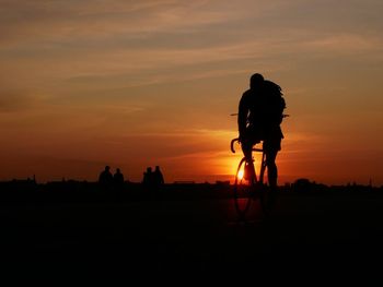 Bike driver in sunset