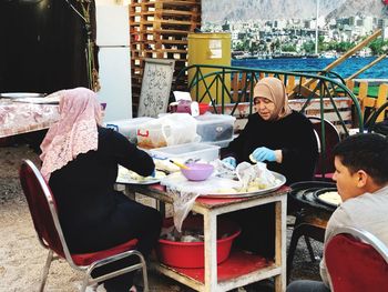 High angle view of people sitting at table