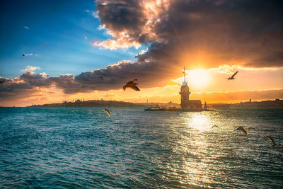 Scenic maiden's tower view of sea against sky during sunset