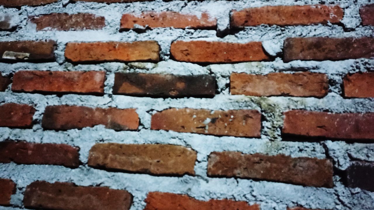 FULL FRAME SHOT OF BRICK WALL ON WHITE BACKGROUND