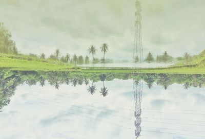 Reflection of trees in lake against sky