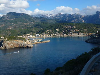 Aerial view of townscape by sea against sky poto soller, majorca