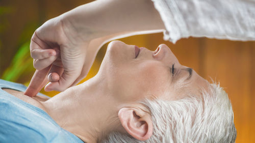 Close-up of woman getting massage at spa