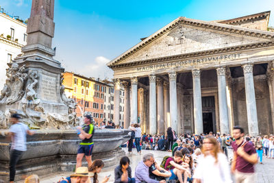 Group of people in front of historical building