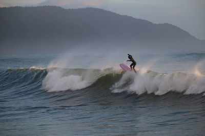Man surfing big waves in the ocean