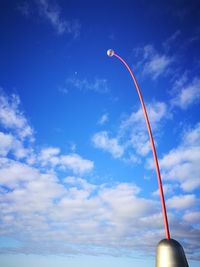 Low angle view of vapor trail against blue sky