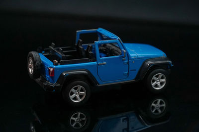 Close-up of toy car against black background