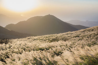 Scenic view of mountains against sky during sunset