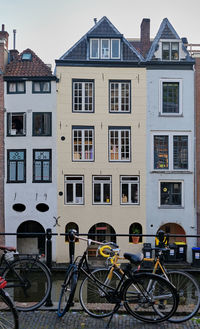 Utrecht, the netherlands. historic houses on the oudegracht canal. bikes in the foreground.