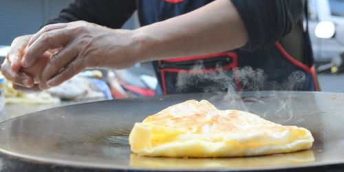 Close-up of person preparing food