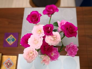 Close-up of pink roses on table