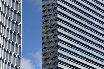 Low angle view of buildings against blue sky