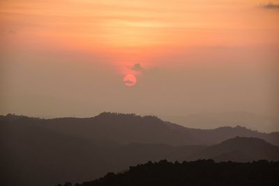 Scenic view of silhouette landscape against romantic sky at sunset