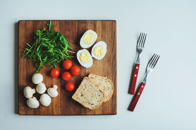 High angle view of fruits and vegetables on cutting board