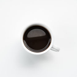 High angle view of black coffee on table