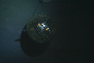 Illuminated lighting equipment hanging at night