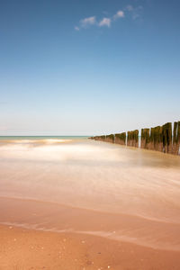 Scenic view of beach against clear sky