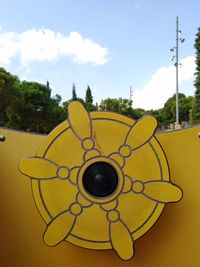 Close-up of camera against sky