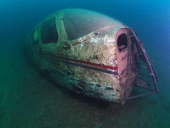 Abandoned boat in sea