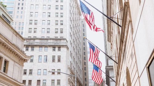 Low angle view of american flags in new york downtown 
