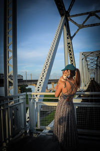 Woman standing against sky