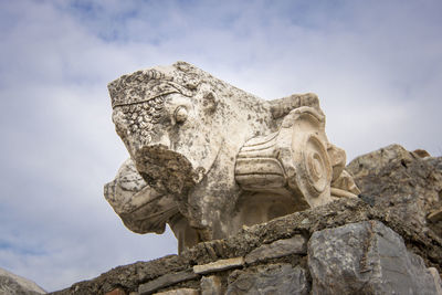 Low angle view of statue against sky