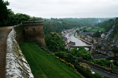 High angle view of river by cityscape against sky