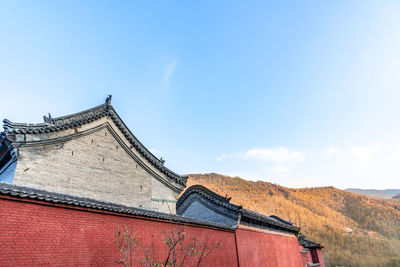 Low angle view of roof of building against sky