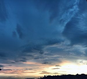 Low angle view of dramatic sky during sunset