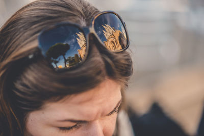 Close-up portrait of woman wearing sunglasses