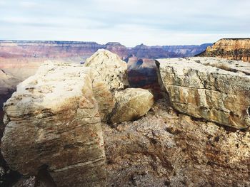 Rock formations on landscape against sky