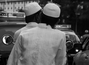 Rear view of two islamic men