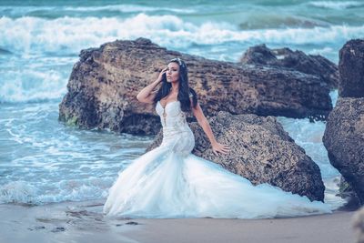 Woman looking at sea shore