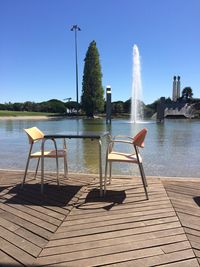 View of calm lake against blue sky