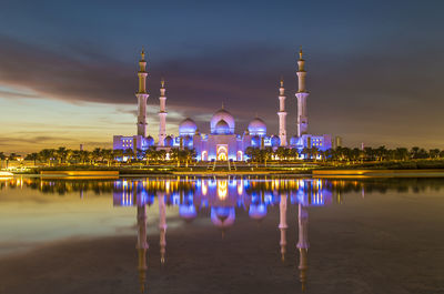 Reflection of illuminated buildings in water at night