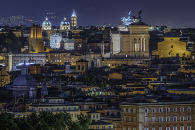 View of illuminated cityscape against sky