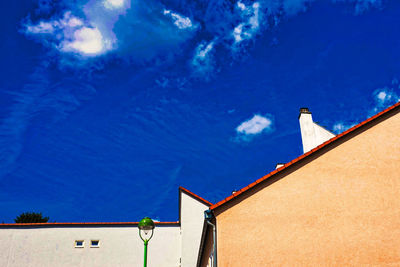 Low angle view of building against blue sky