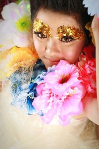 Close-up of girl with pink flowers