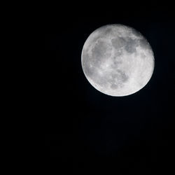 Low angle view of moon against clear sky at night