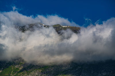 Scenic view of volcanic mountain against sky