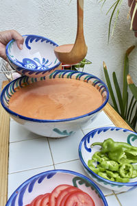 Gazpacho, andalusian and some ingredient to prepare it, such as tomato,