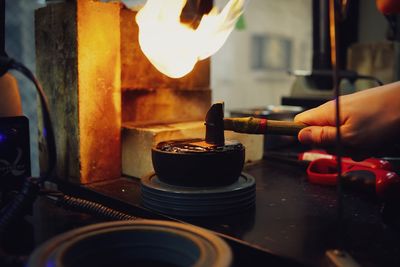 Cropped hand of craftsman working 