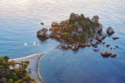 High angle view of rocks by sea