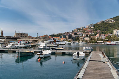 Boats moored at harbor